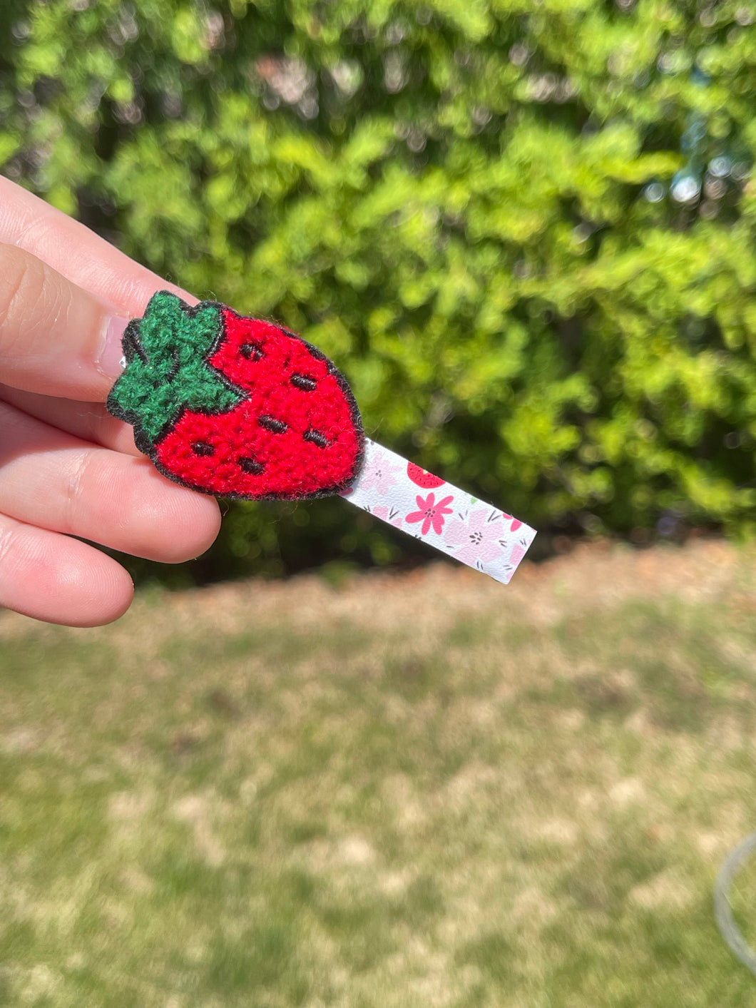 Fuzzy strawberry on a bar clip